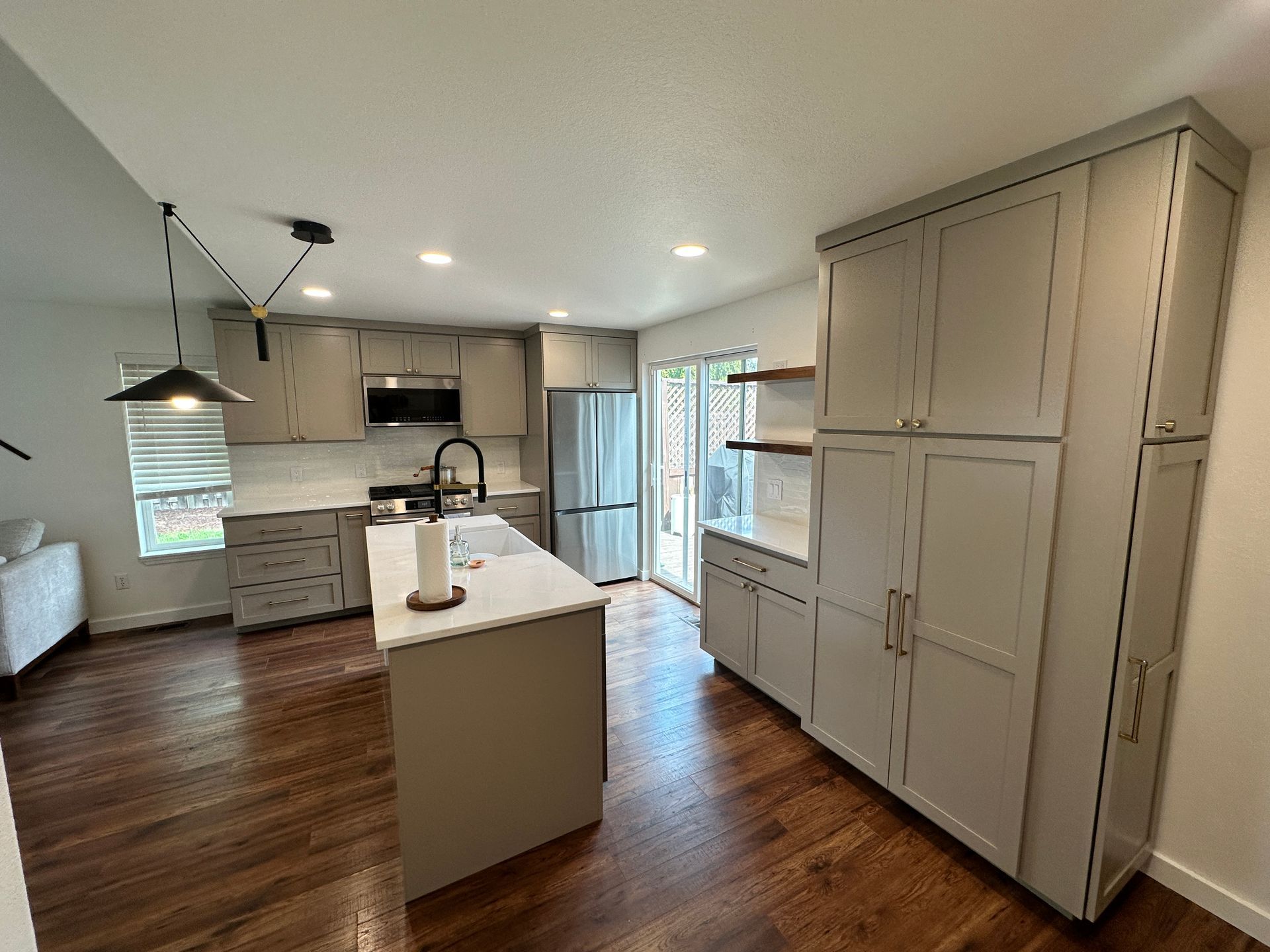 A kitchen with a large island in the middle of the room.
