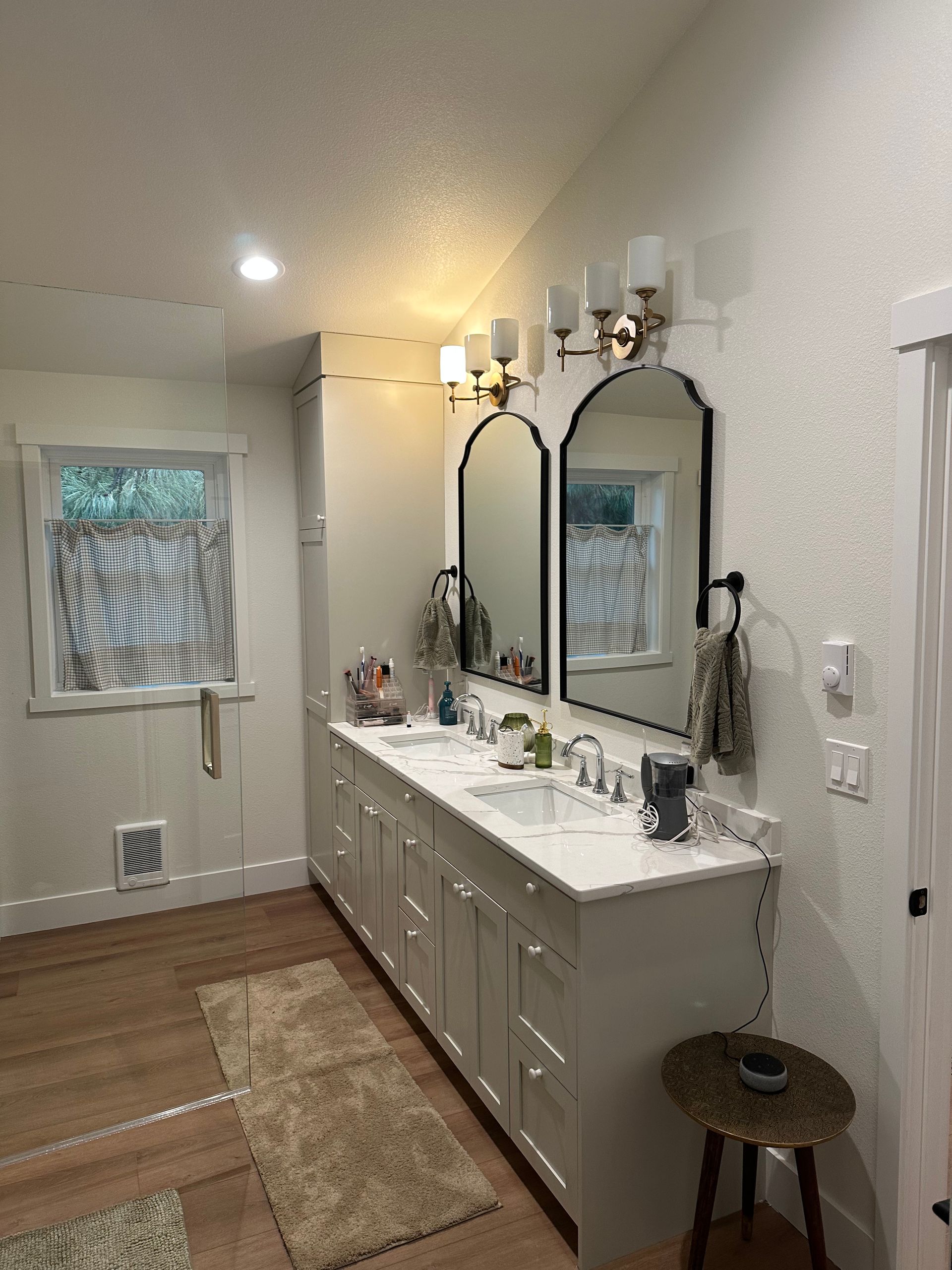 A bathroom with two sinks and two mirrors.
