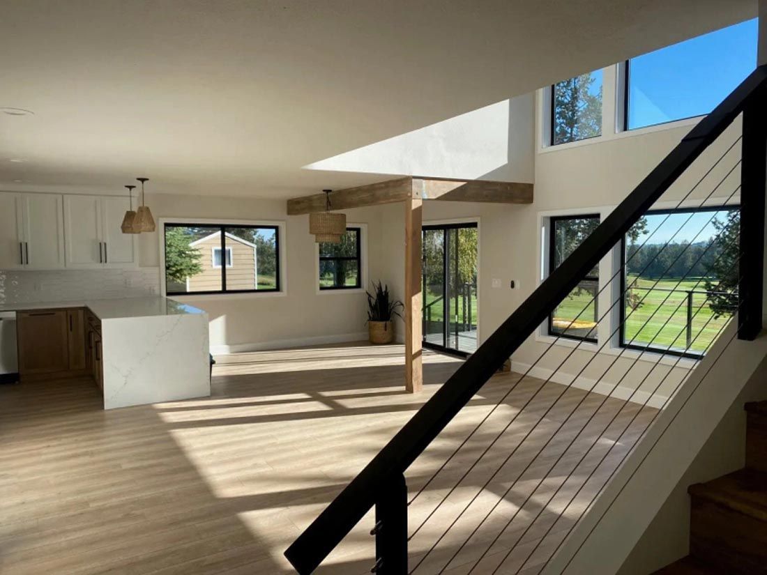 An empty house with a staircase leading up to the second floor