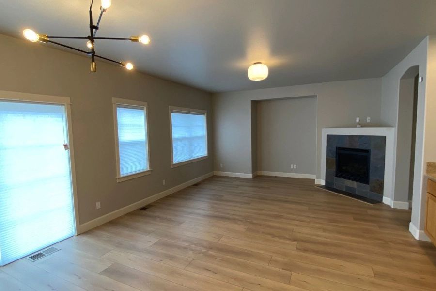 There is a fireplace in the middle of the living room.