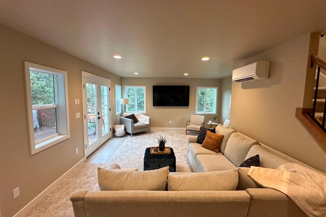 A living room filled with furniture and a flat screen tv.