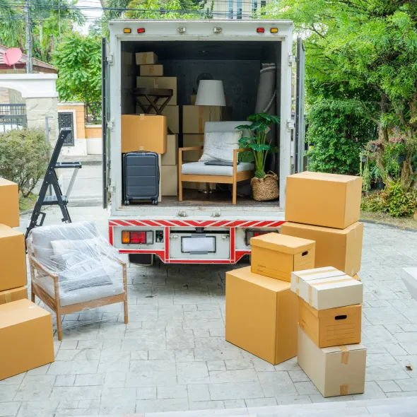 Hall's Hauling - A moving truck is filled with boxes and furniture.