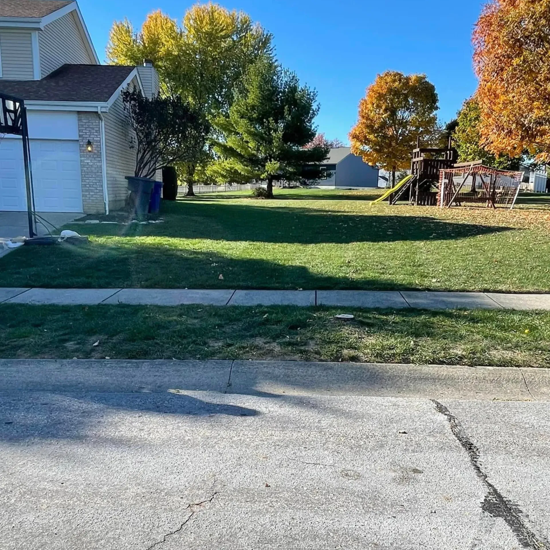 Hall's Hauling -A house with a large lawn in front of it