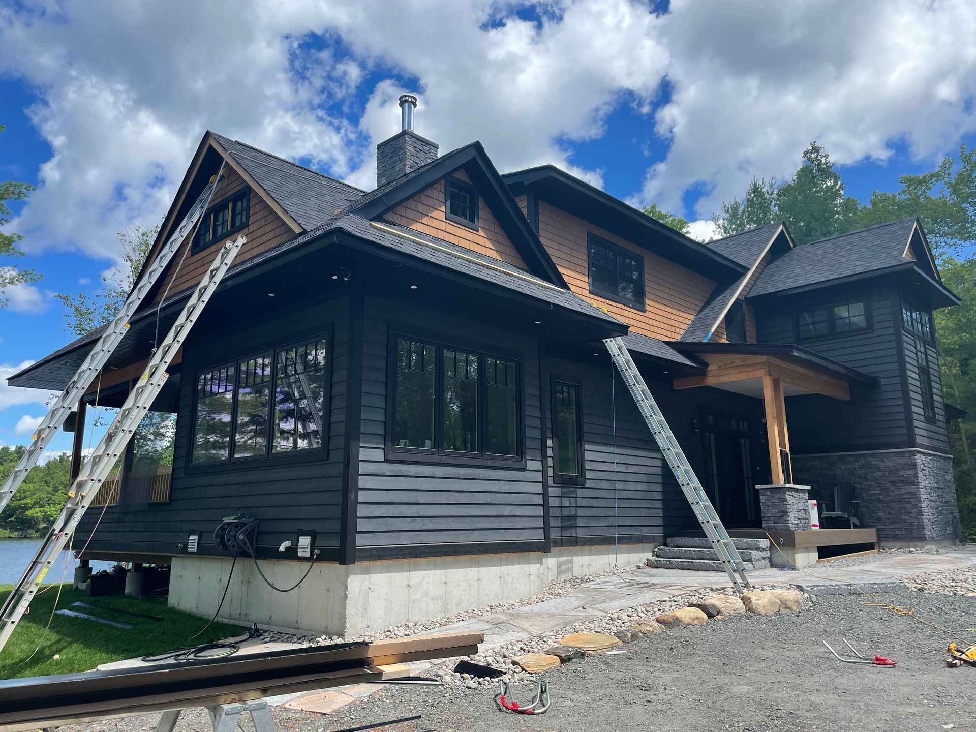 A large house with a lot of windows is being built.