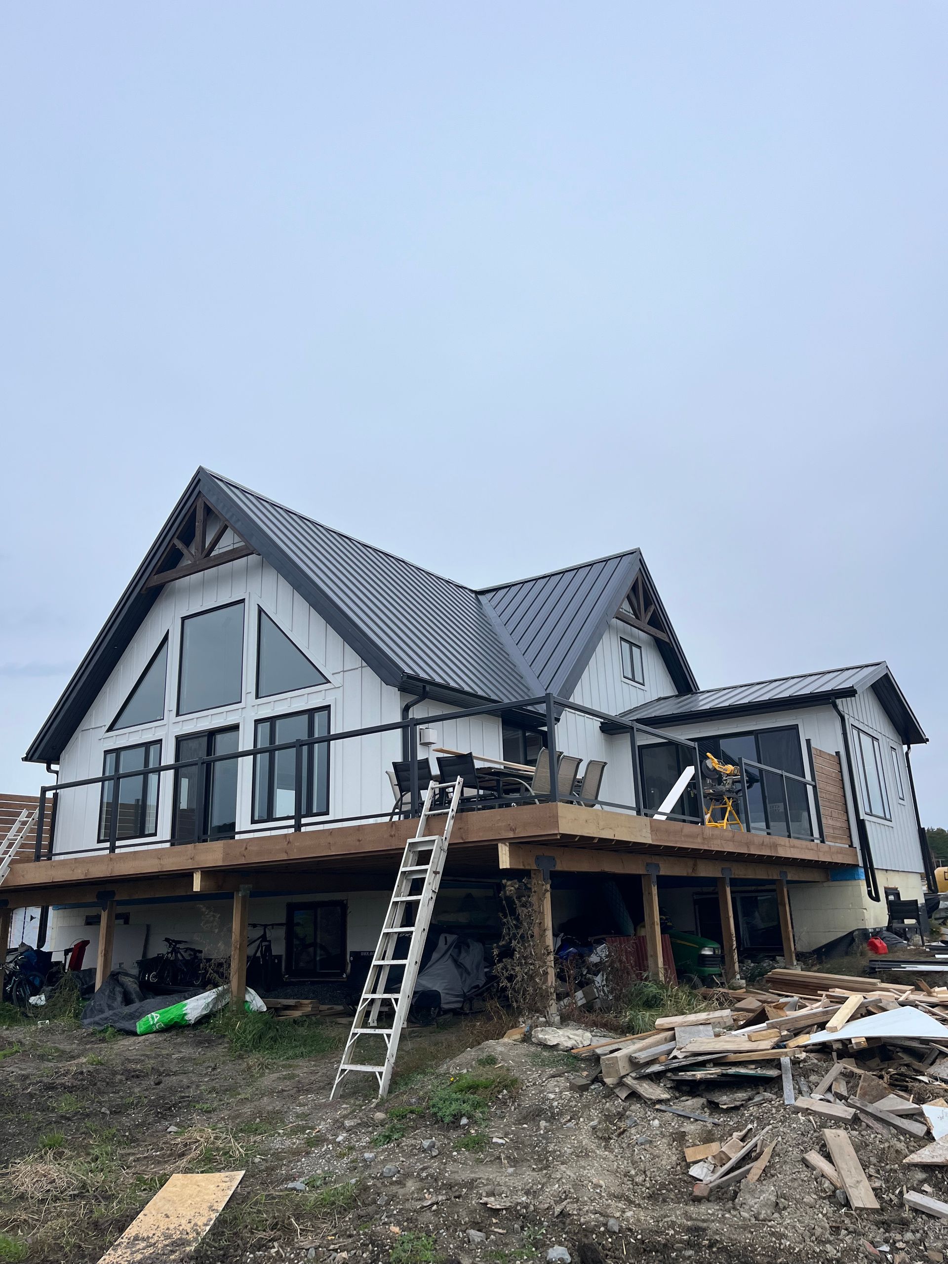 A large house with a ladder on the side of it.