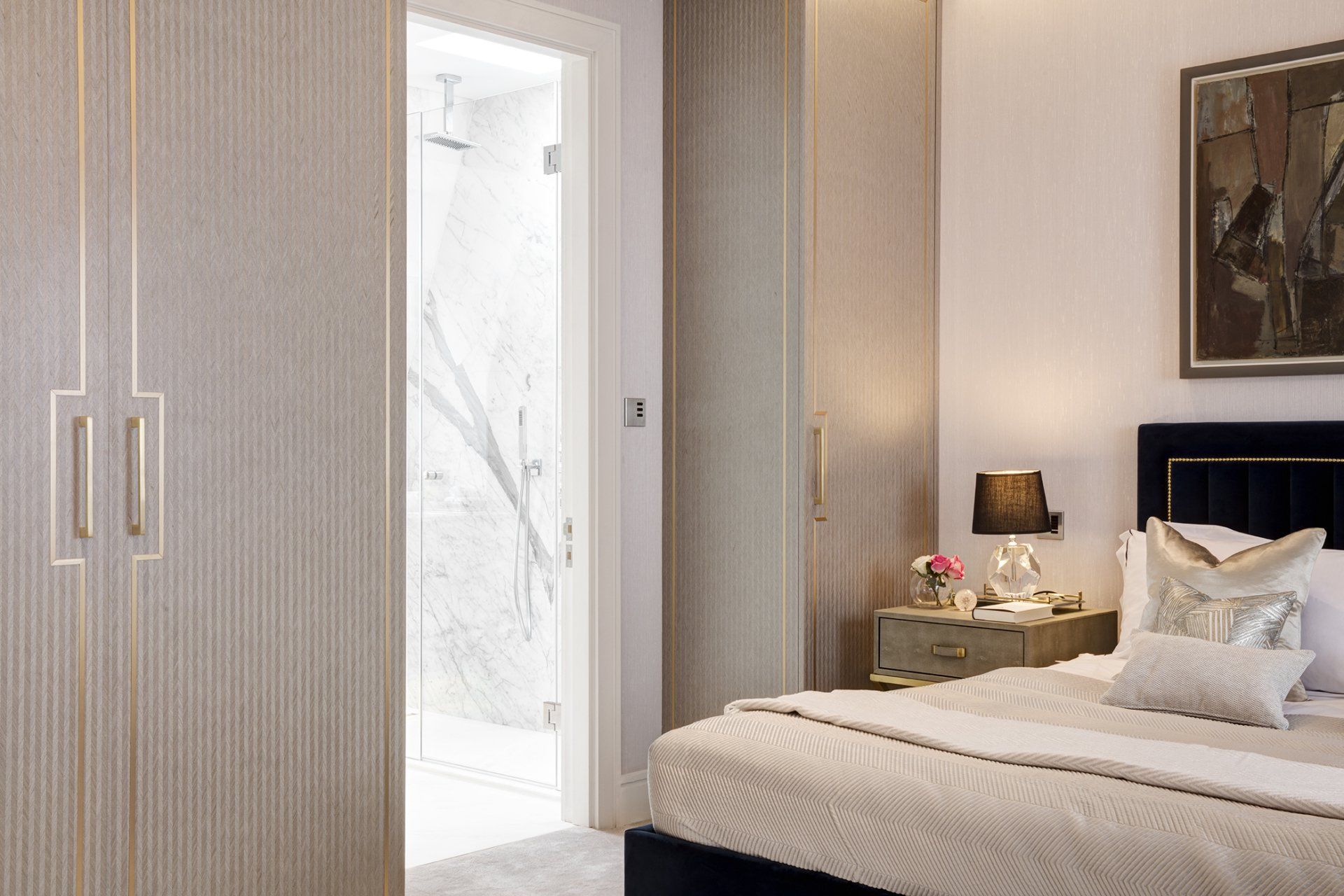 An empty room with a fireplace and a chandelier