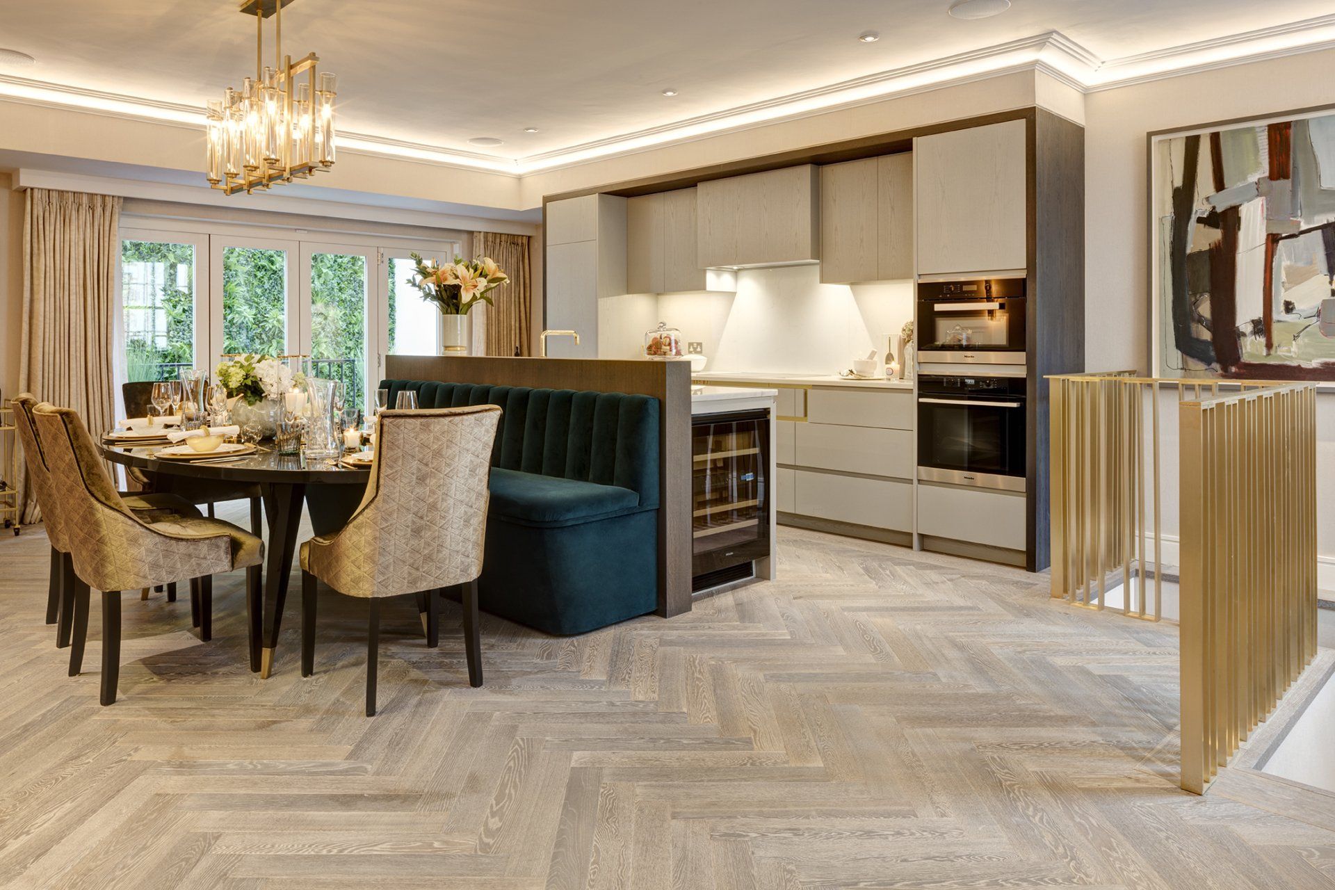 A dining room with a table and chairs and a kitchen