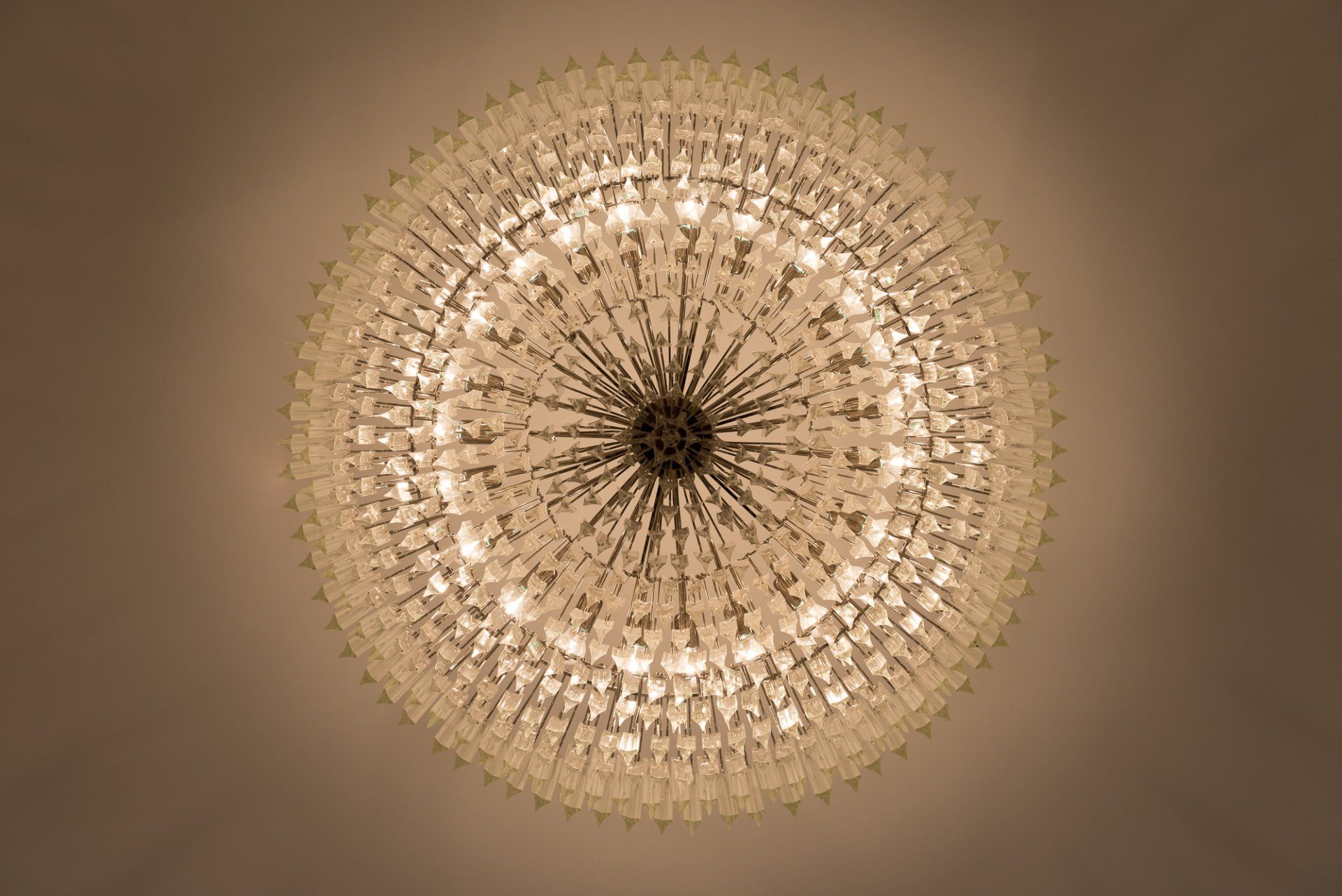 A chandelier with a lot of lights hanging from it