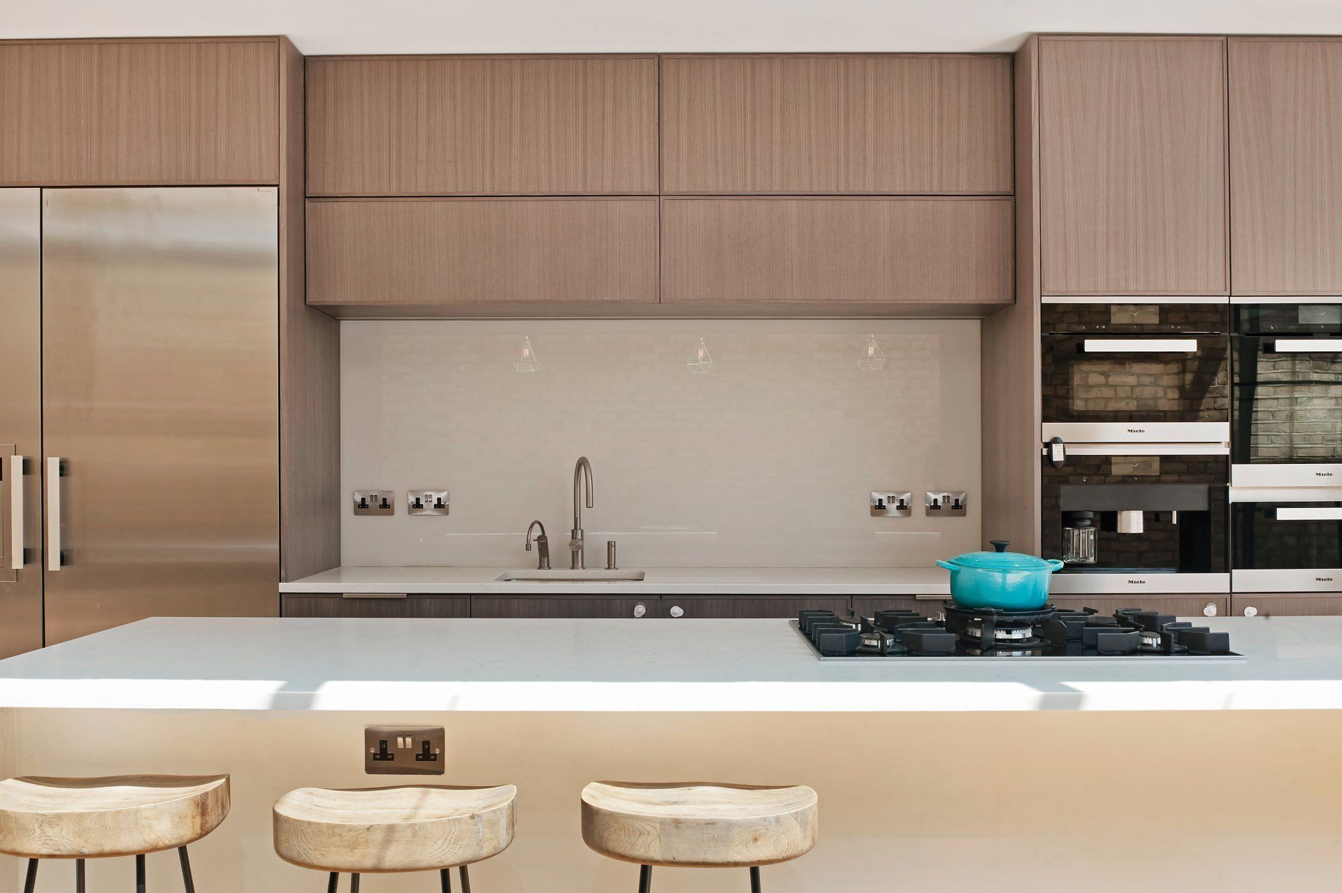 A kitchen with stainless steel appliances and wooden cabinets