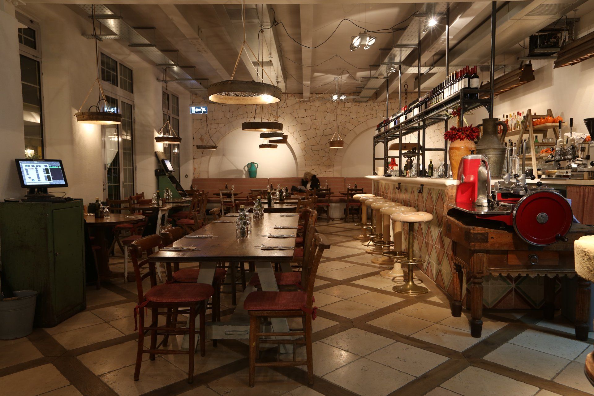 A restaurant with tables and chairs and a machine that says ' a ' on it