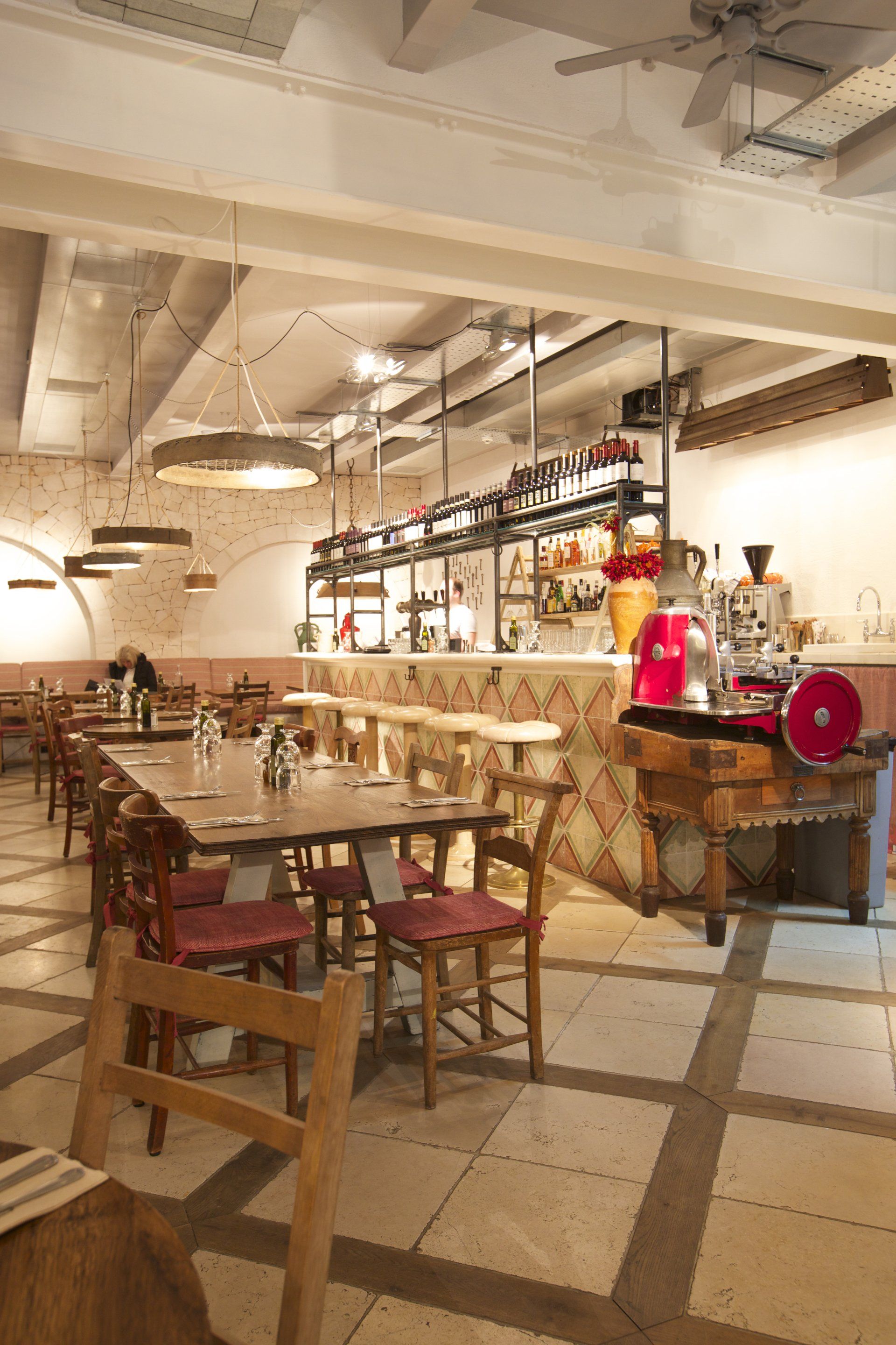 The inside of a restaurant with tables and chairs