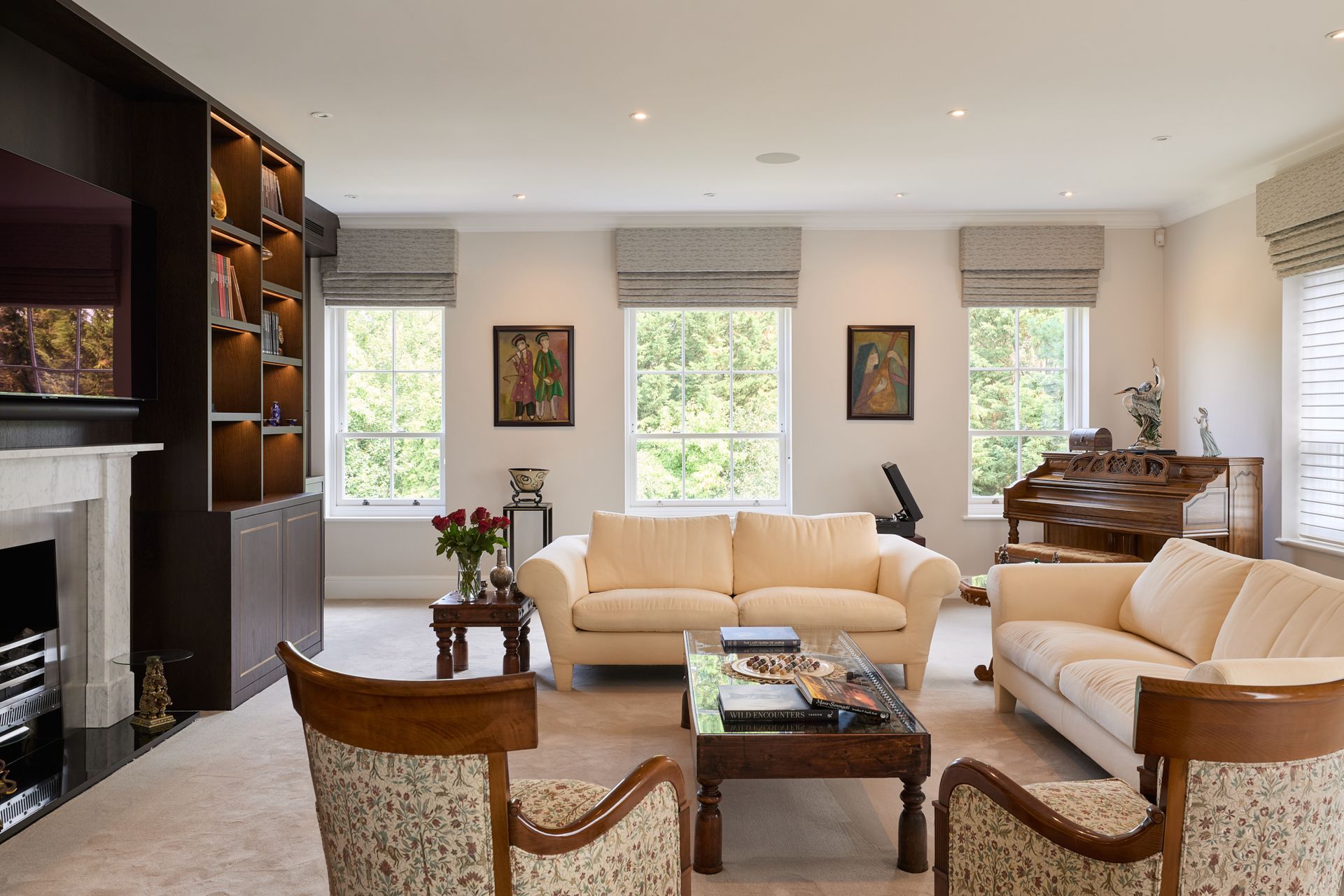 A living room filled with furniture and a piano