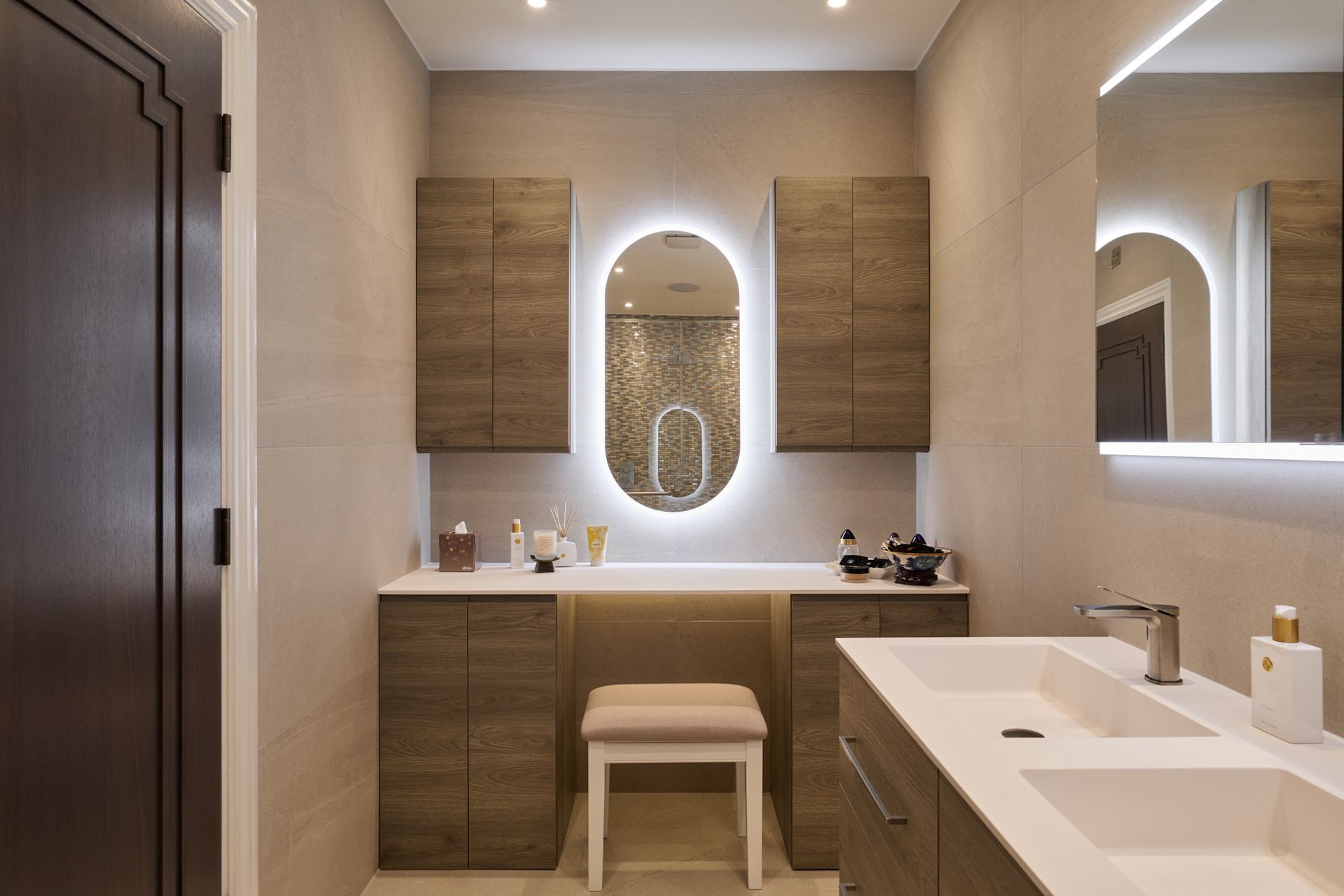 A bathroom with two sinks and a mirror