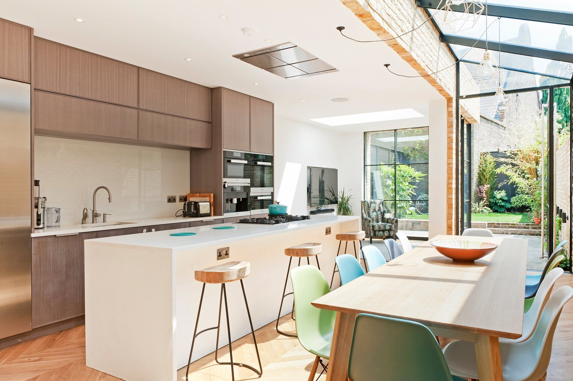 A kitchen with a large island and a dining table