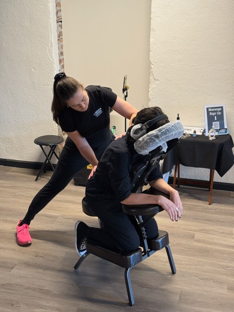 Woman jogging in park on a sunny day, wearing leggings and pink shoes.