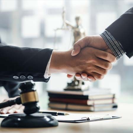 Businessman handshake partner lawyers or attorneys discussing a contract agreement
