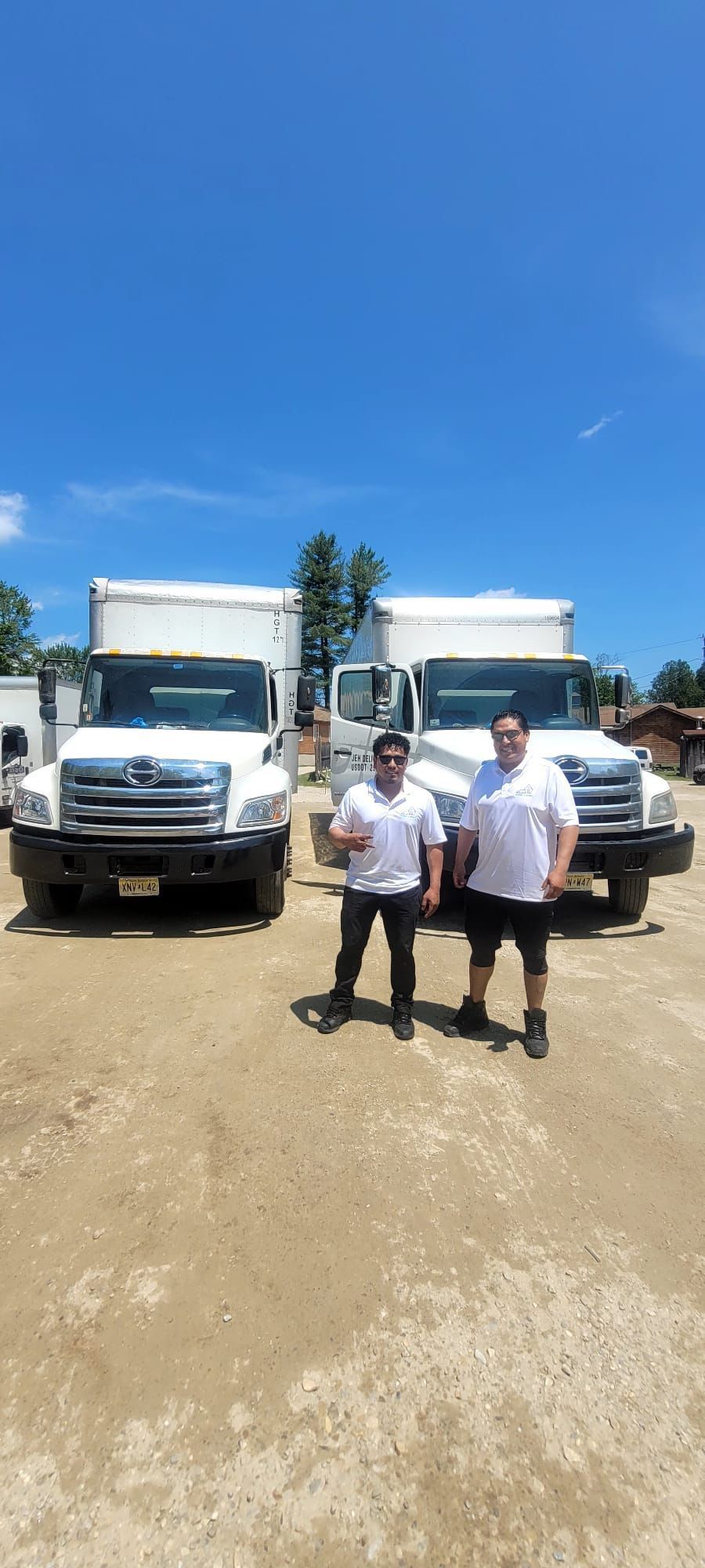 A person is taping a cardboard box with tape.