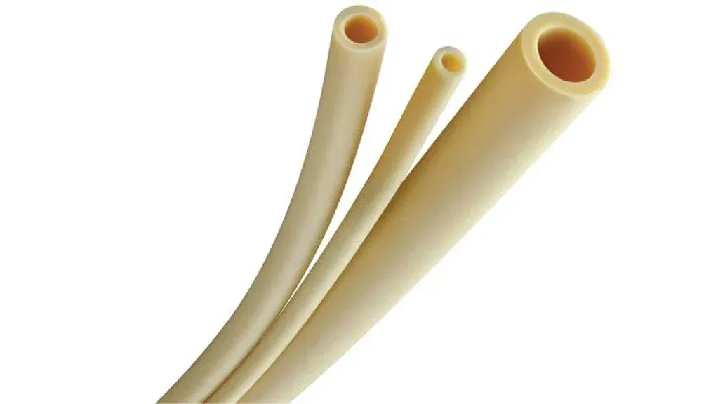 Three tan-colored, hollow tubes of varying sizes, possibly tubing or straws, against a white background.
