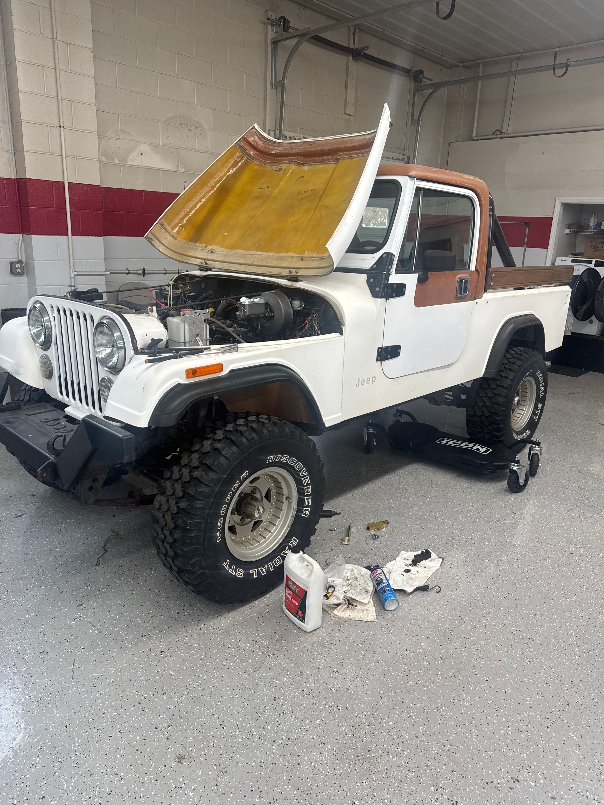 Jeep Wrangler Undergoing Repair Inside Auto Shop Bay | Dustin's Automotive Service Center