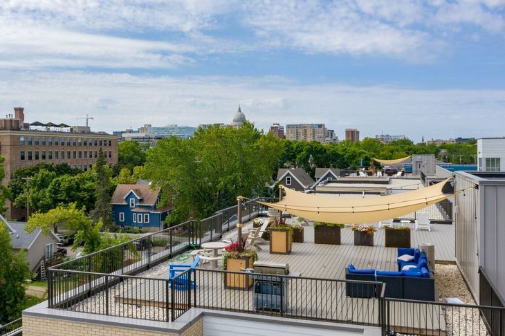 An aerial view of a swimming pool on the roof of a building