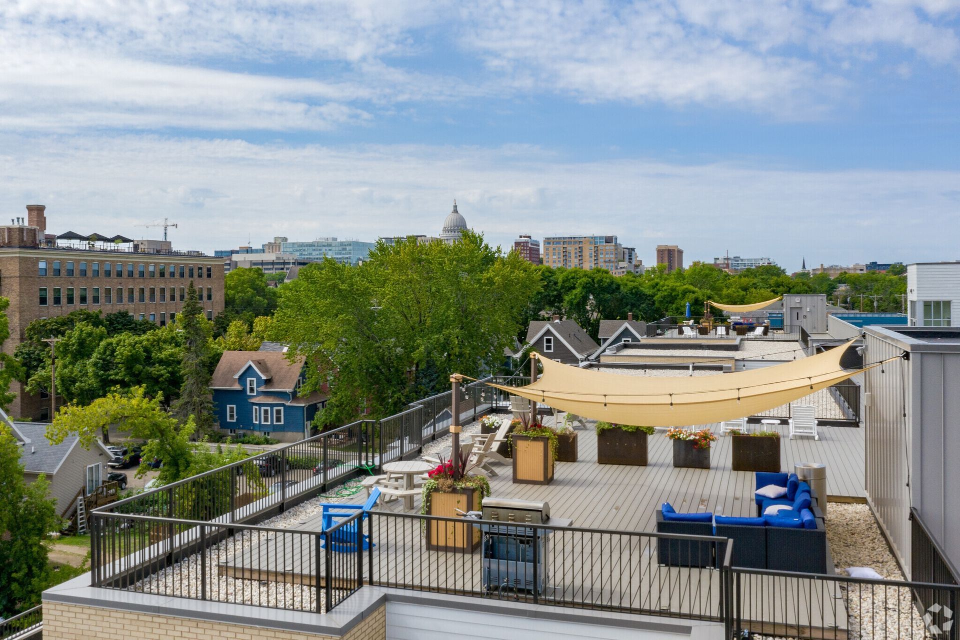An aerial view of a swimming pool on the roof of a building