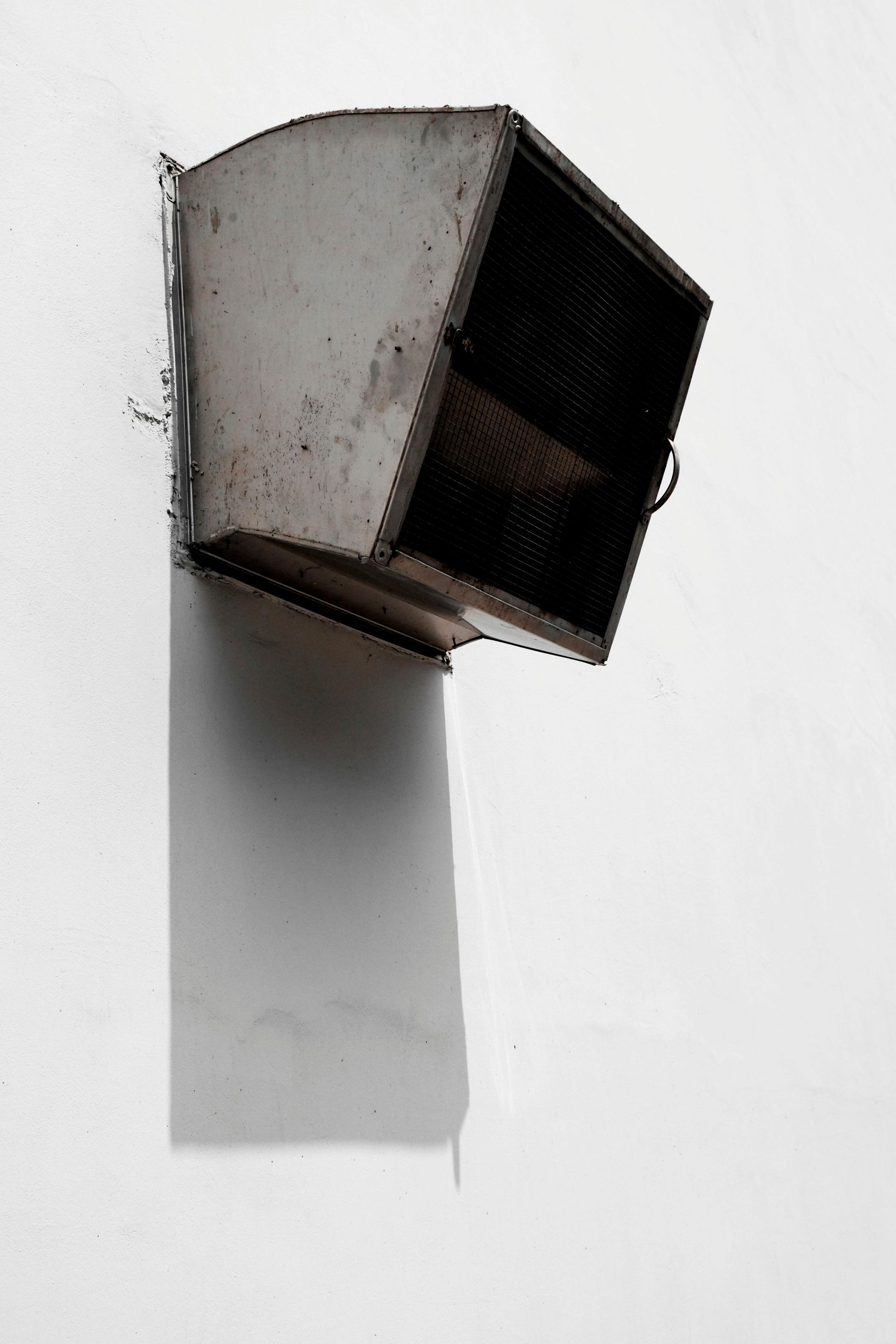 A white wall with a black box on it