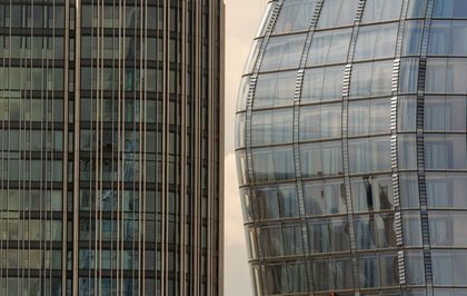 A close up of two tall buildings next to each other.
