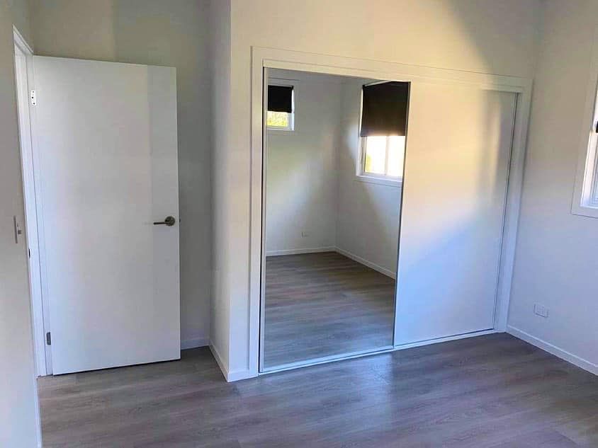 There is a large mirror in the middle of the room.