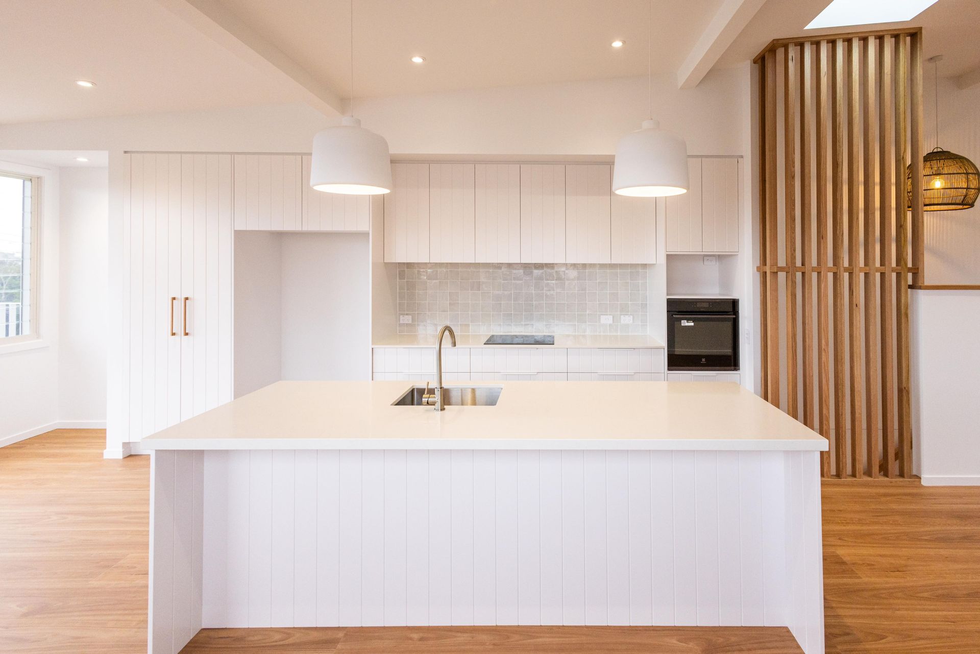 There is a large island in the middle of the kitchen.