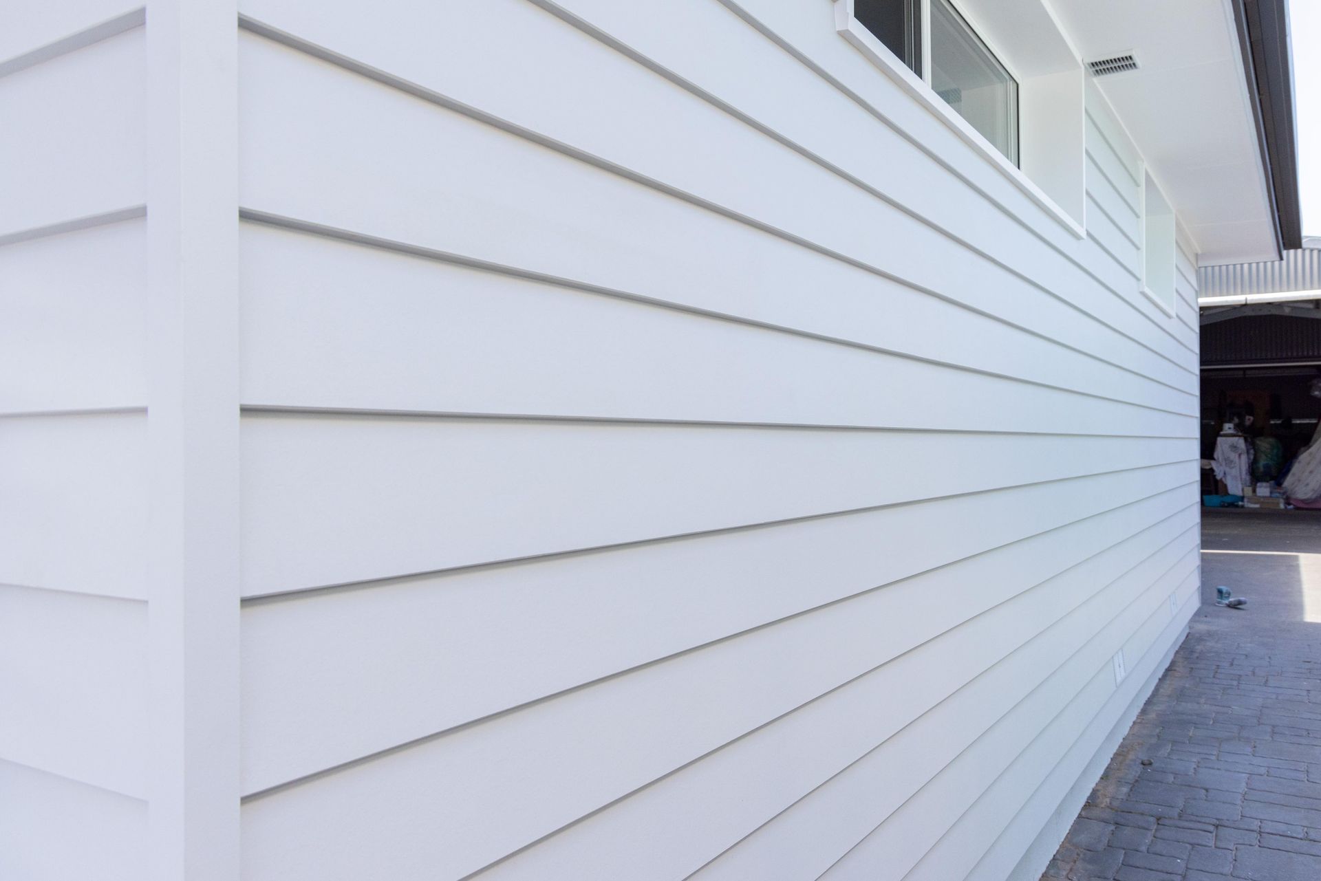 A close up of a white siding on a house