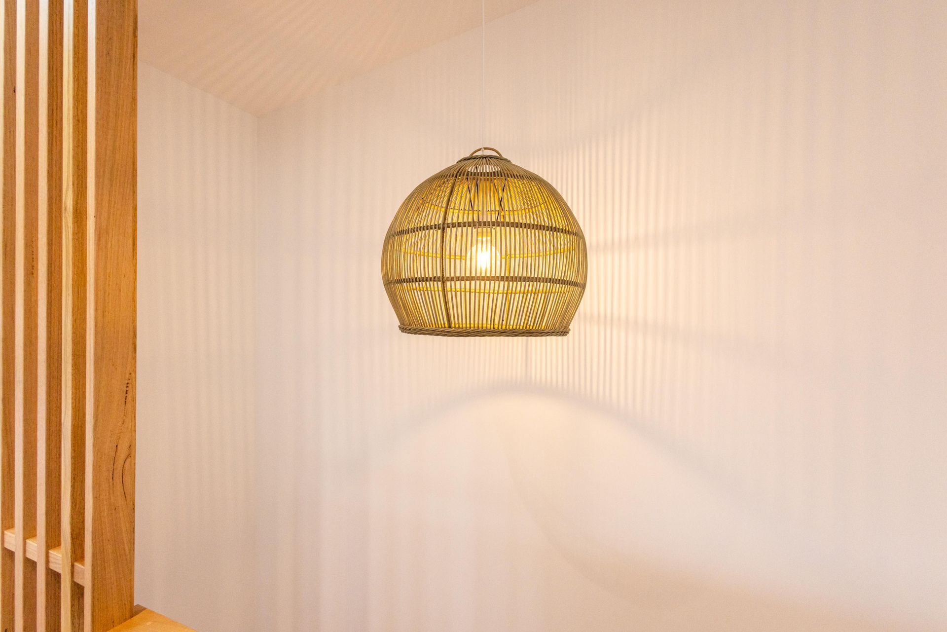 A pendant light is hanging from the ceiling in a room.