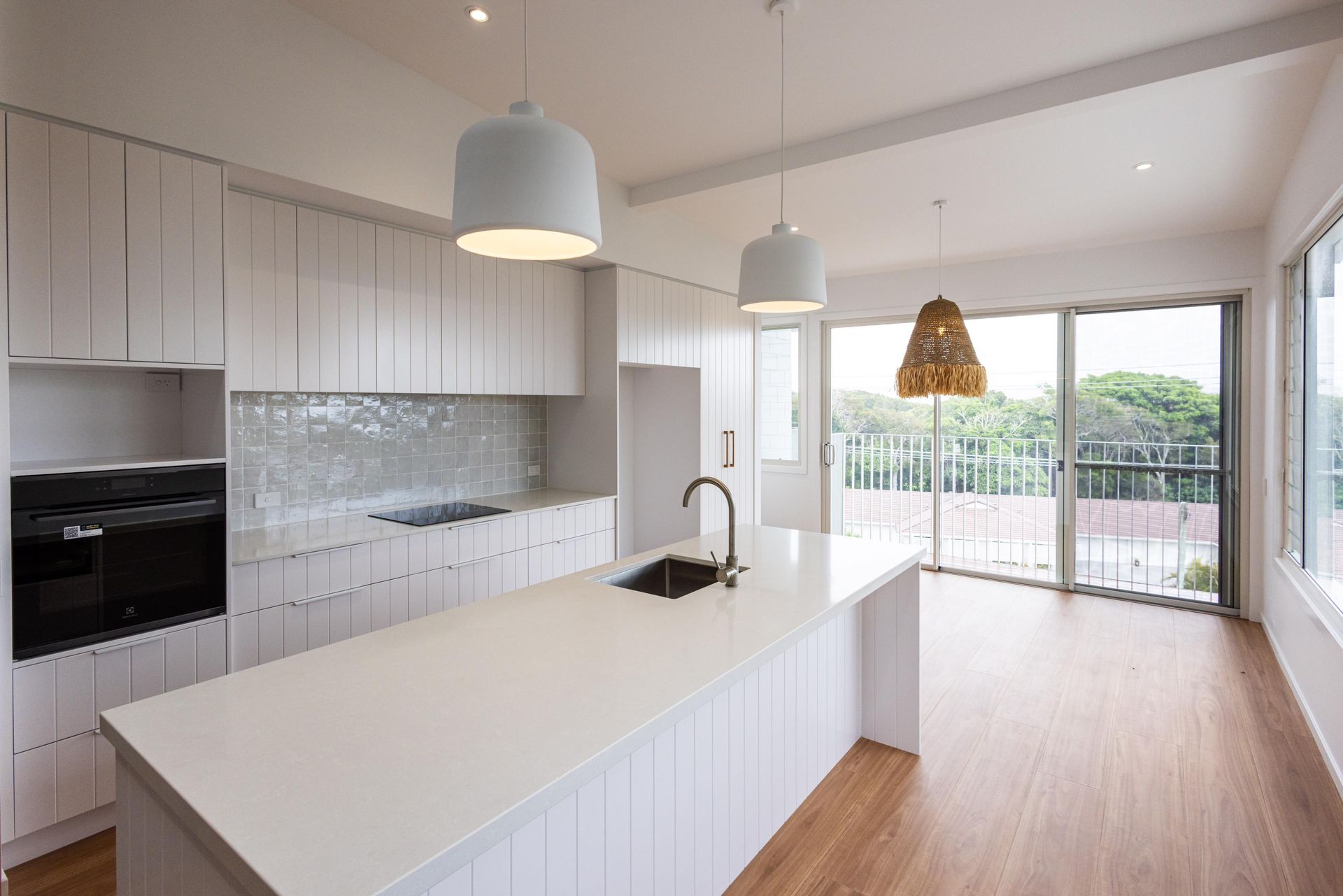 There is a large island in the middle of the kitchen.