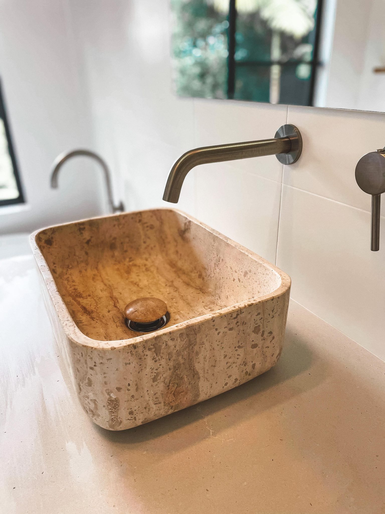 a bathroom sink with a faucet and a mirror .