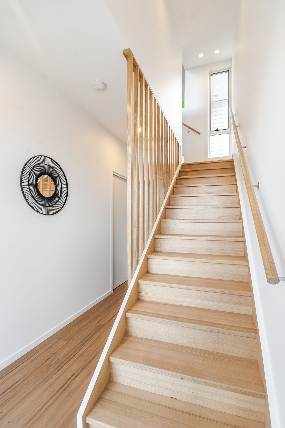 a bathroom with a sink , mirror and toilet