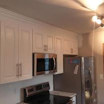 A wooden fence is sitting on the side of a house.