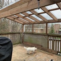 A kitchen with white cabinets and a stainless steel sink