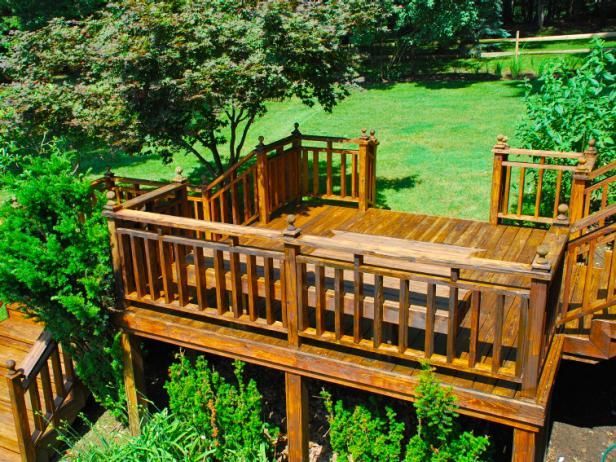 A wooden deck with stairs leading up to it