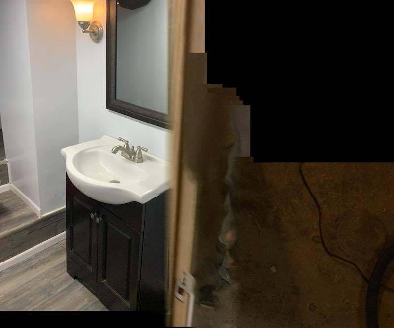 The stairs are made of wood and have a white railing.