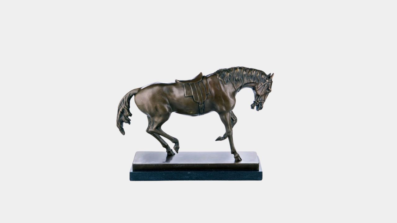 bronze sculpture  saddled horse
