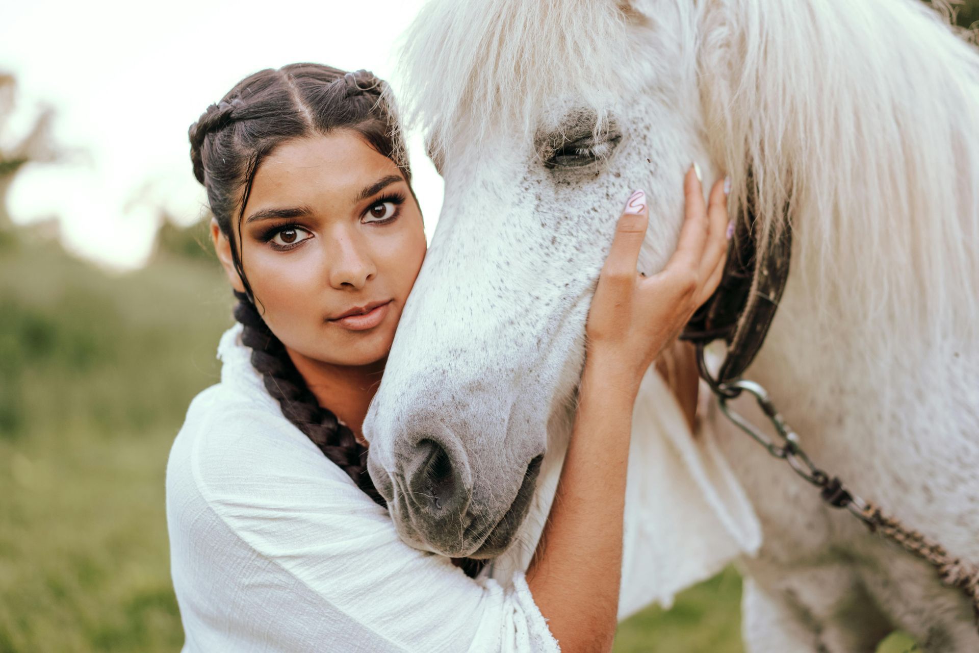 lady hugging her horse