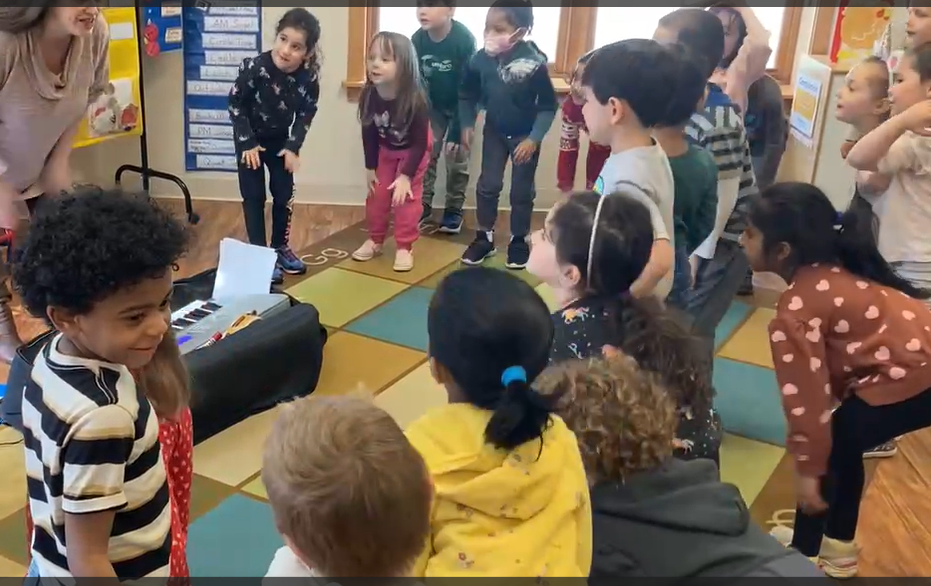 Teacher Exercising With Her Students