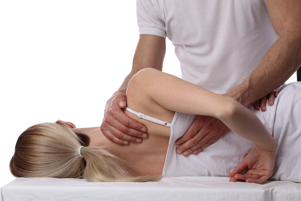A Person Receiving a Back Adjustment from A Practitioner — My Chiropractor Mackay City in Proserpine, QLD