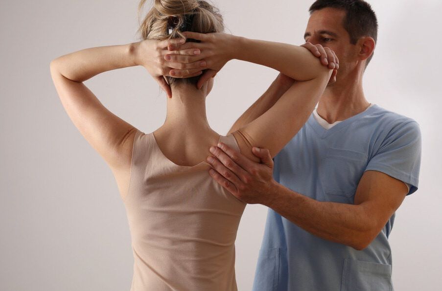 Woman Receiving Shoulder and Back Adjustment — My Chiropractor Mackay City in Mackay, QLD