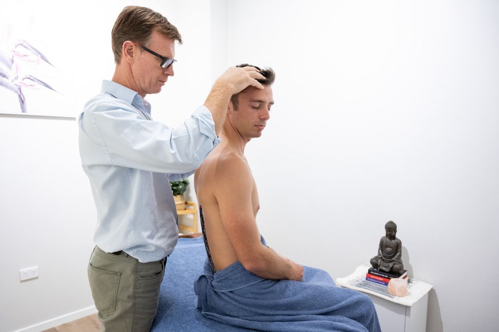 Chiropractor Treating Migrains Through Various Methods