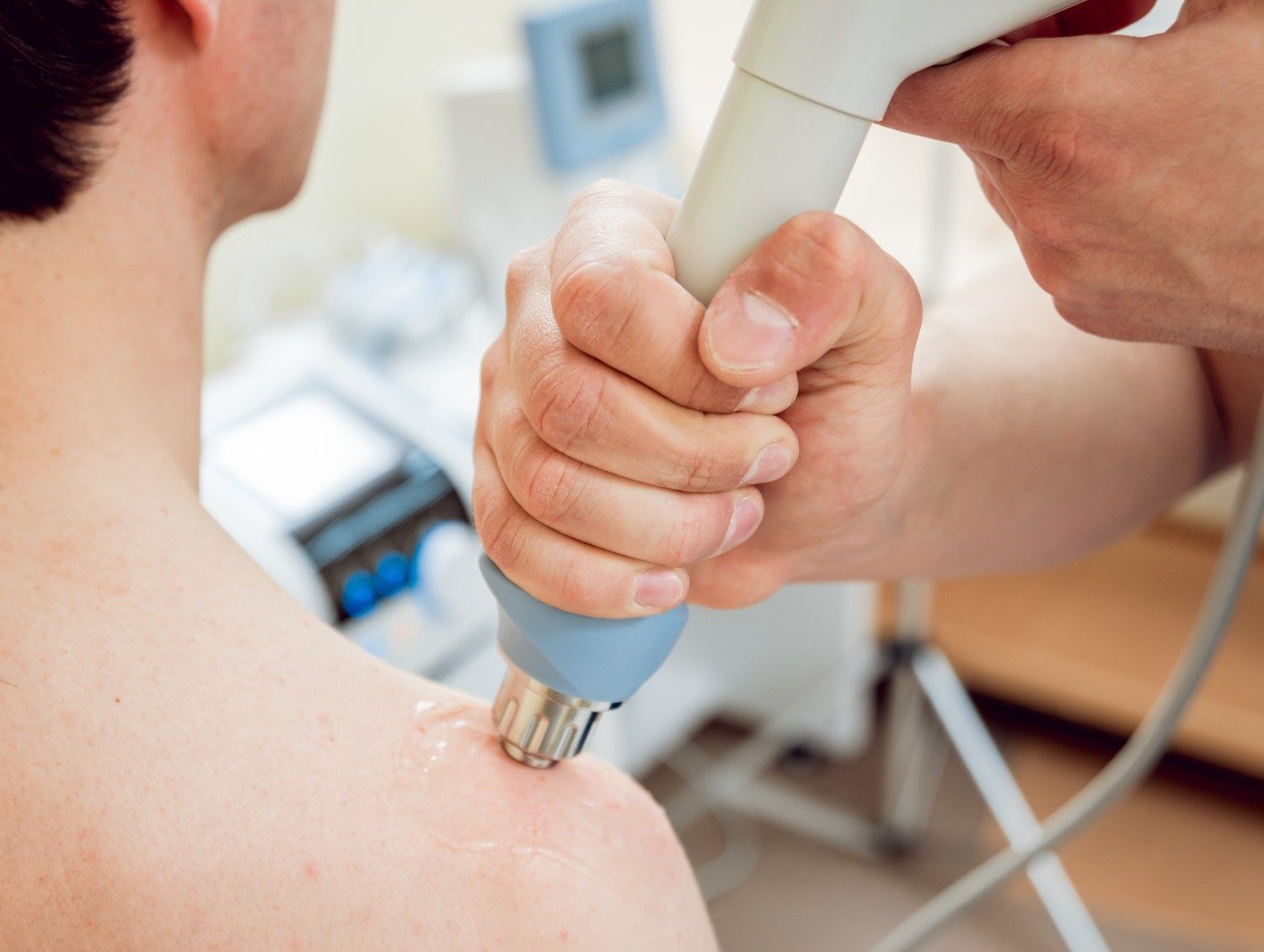 Person Receiving Shockwave Therapy on Shoulder — My Chiropractor Mackay City in Marian, QLD