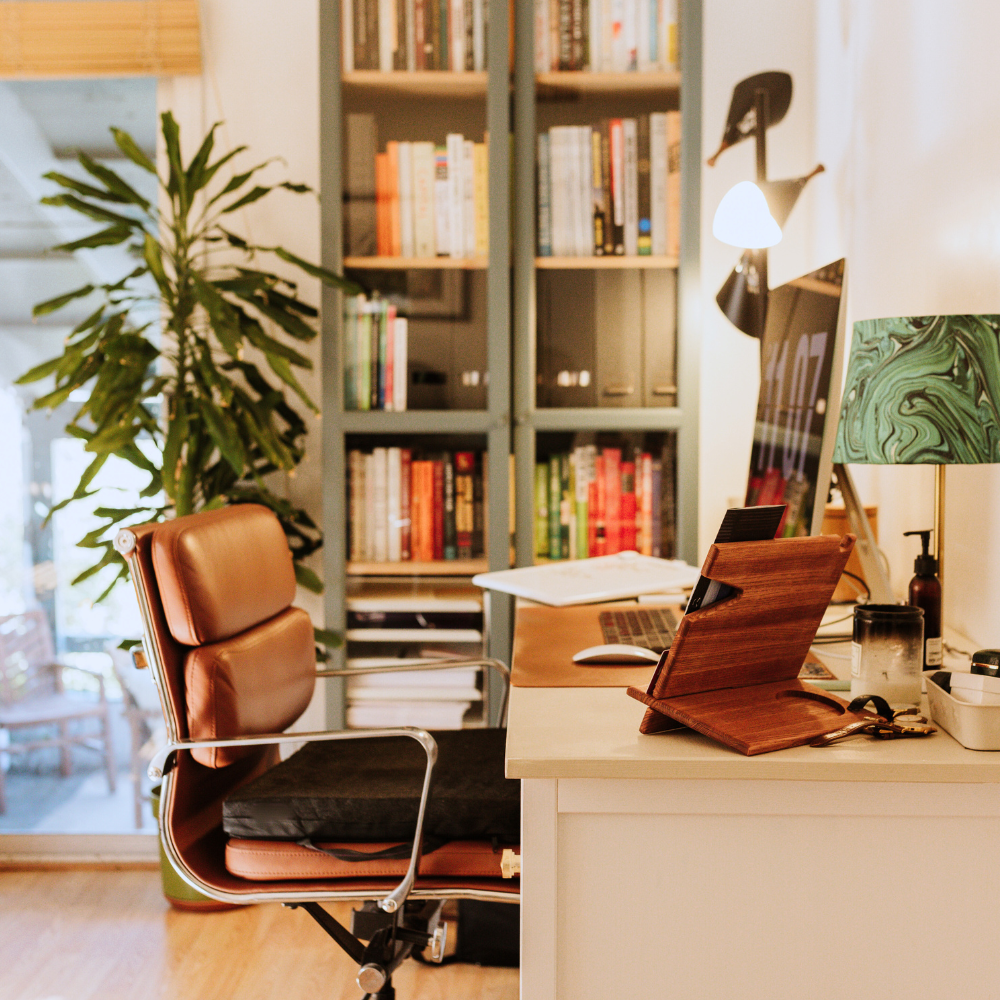 A desk with a chair and a laptop on it. Eden Creative Arts - Private Christian Micro School
