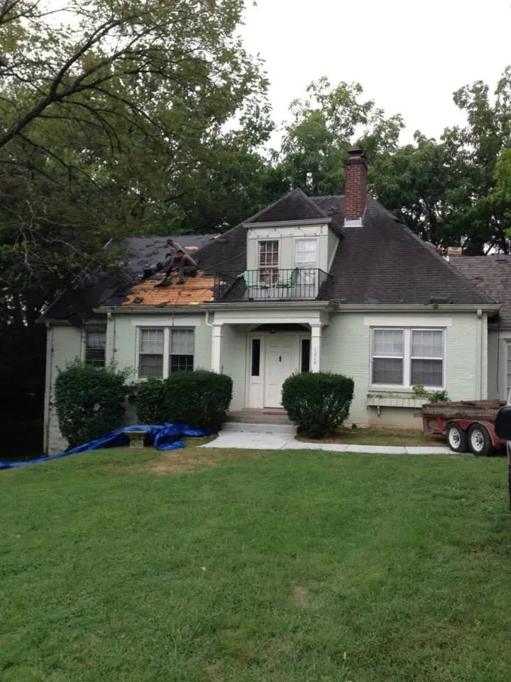 A house with a roof that is being repaired