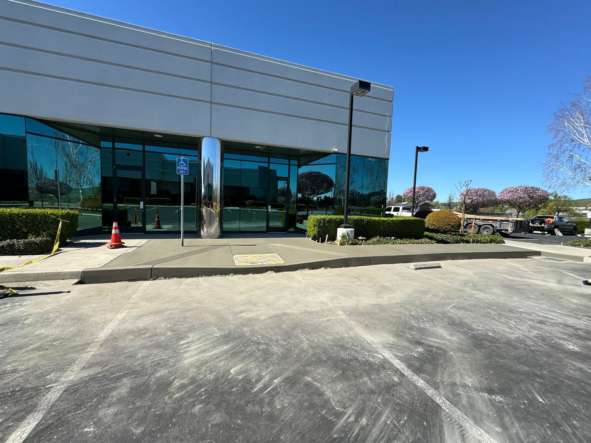 A large building with a parking lot in front of it