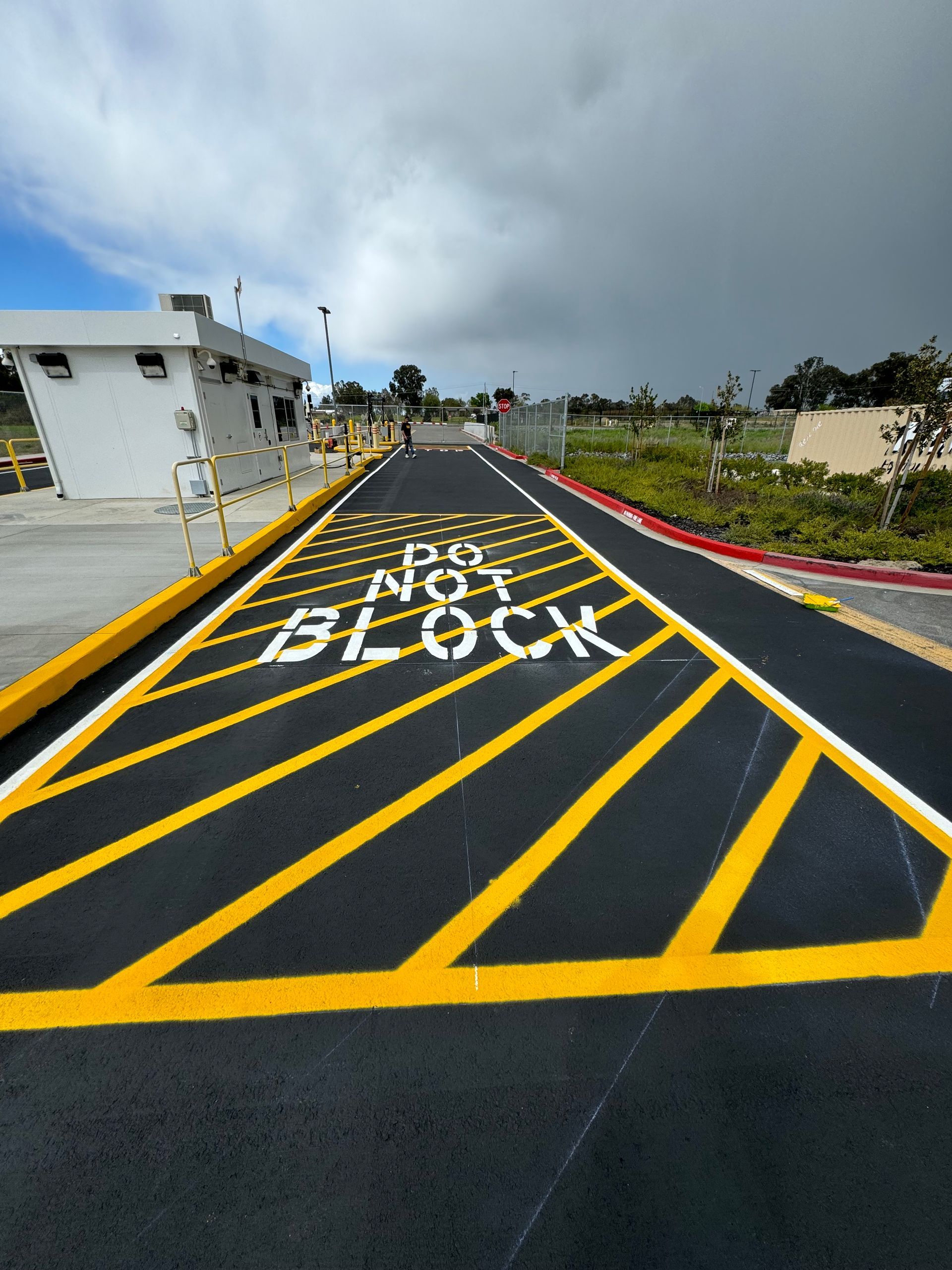 The word block is painted on the side of the road