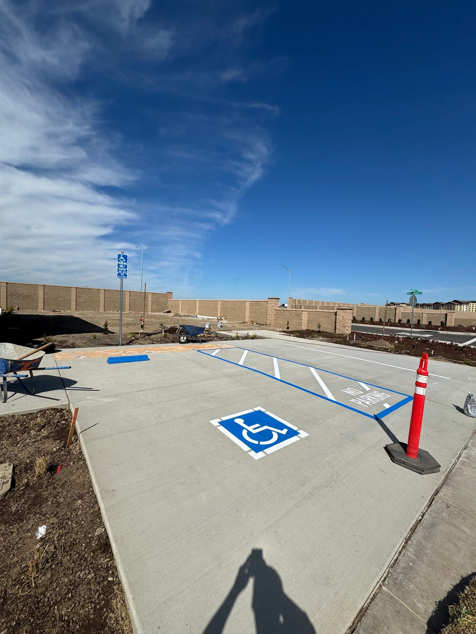 A parking lot with a handicap sign painted on it